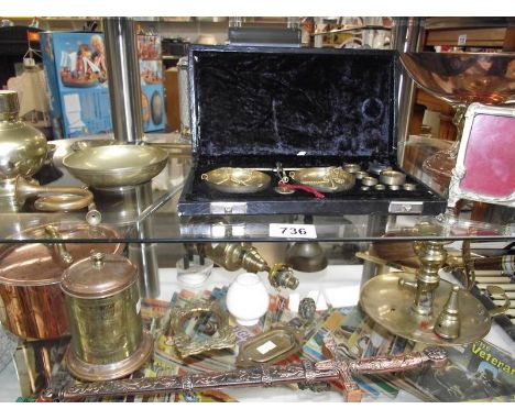 2 shelves of brass and copper including cased scales, French pigeon lamp, chamber candlestick etc.,
