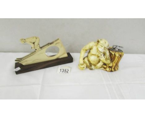 An art deco 'ivoreen' monkey novelty table lighter by "BYO" Prince, circa 1940 and an art deco 'ivoreen' downhill skier watch