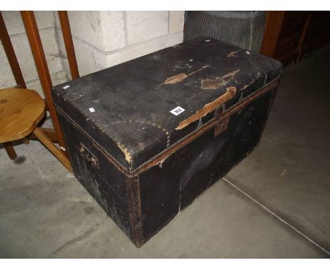 A vintage leather covered pine trunk.