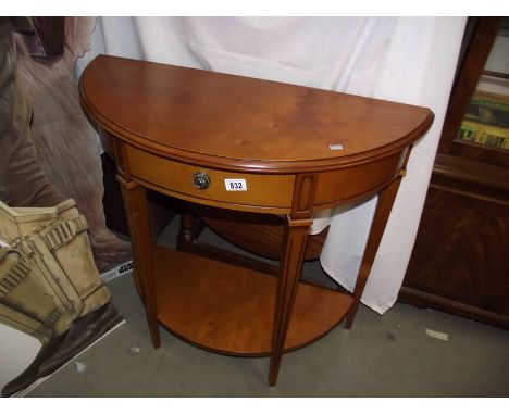 A light mahogany finished D end hall table with drawer and shelf.
