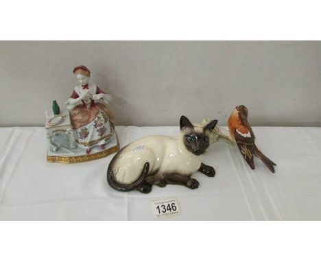 A Royal Doulton Siamese cat, a Goebel robin on branch and a lady at dressing table.