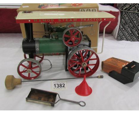 A boxed Mamod steam traction engine.