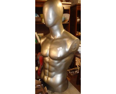 Shop display: Mannequin torso of a man with no face