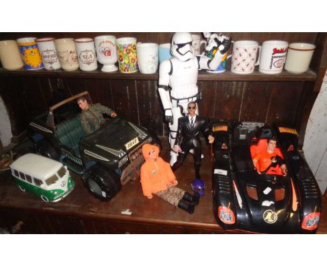 Action Man car, Man in Black figure, Action Man jeep, a VW camper table lamp and a Jakks Star Wars Stormtrooper figure