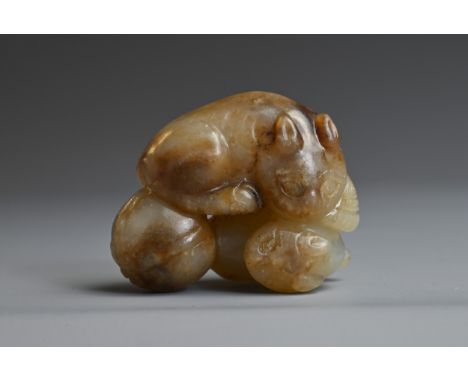 A CHINESE PALE CELADON AND BROWN JADE CAT GROUP PENDANT. Two cats next to a tied bag. 4.5cm length. Weight 48 grams. Overall 