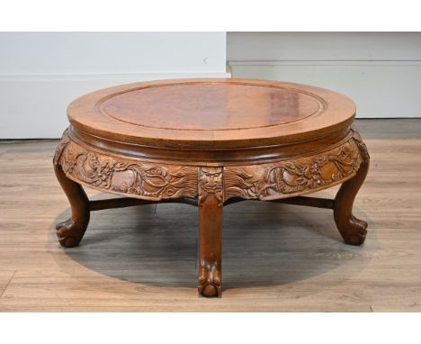 A 20TH CENTURY CHINESE CARVED HARDWOOD AND BURR WALNUT CIRCULAR LOW COFFEE-TABLE. With moulded central burr panel to top abov