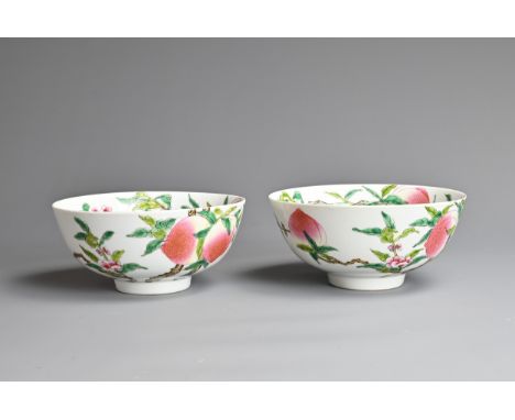 A PAIR OF CHINESE FAMILLE ROSE PEACH BOWLS, QIANLONG MARK. Each bowl decorated with nice peaches on flowering branches with t