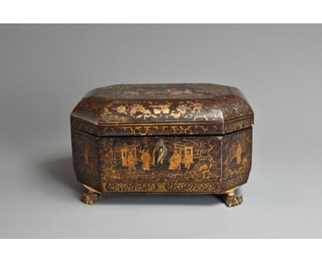 A CHINESE EXPORT BLACK AND GILT LACQUER TEA CADDY, MID 19TH CENTURY. Of octagonal form on three lion feet decorated with figu