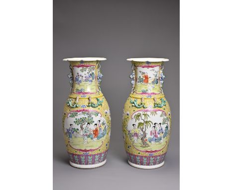 A PAIR OF CHINESE YELLOW GROUND FAMILLE ROSE PORCELAIN VASES, EARLY 20TH CENTURY. Each of baluster form with lobed rim, lion 