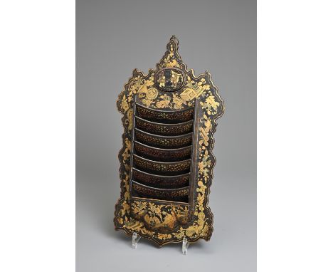 AN EARLY 19TH CENTURY CHINESE EXPORT BLACK AND GILT LACQUER LETTER RACK. Of shaped rectangular scroll-edged form, with a seve