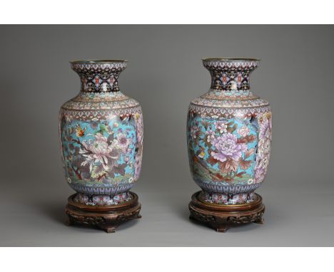 A LARGE PAIR OF CHINESE CLOISONNE ENAMEL VASES, 20TH CENTURY. Of baluster form decorated with birds and floral scenes with bl