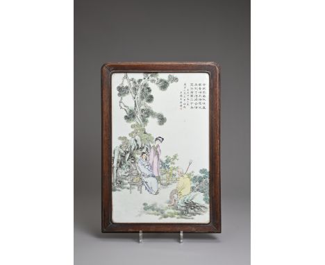 A CHINESE FRAMED PORCELAIN PLAQUE, DATED 1922. Famille rose decorated rectangular porcelain tile decorated with figures in a 