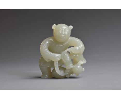 A CHINESE PALE CELADON JADE CARVING OF A BOY AND CAT. 4.5cm tall. Weight 40 grams. Good overall condition.