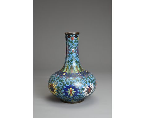 A CHINESE CLOISONNE ENAMEL BOTTLE VASE, EARLY 20TH CENTURY. Decorated with chrysanthemums with leafy stems and band of lotus 