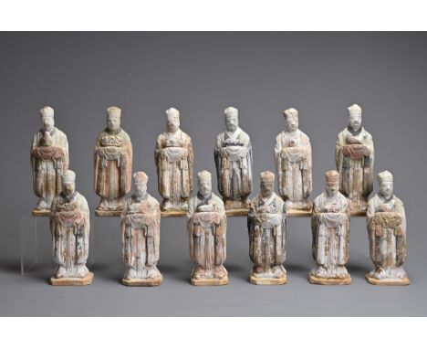 A COMPLETE SET OF TWELVE CHINESE ZODIAC POTTERY FIGURES, MING DYNASTY. Each figure in human form wearing the robes and headge