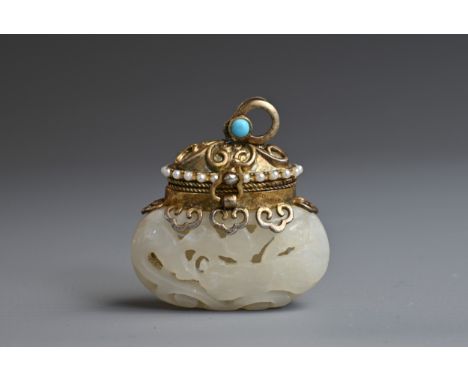 A CHINESE CARVED PALE JADE, SILVER-GILT, TURQUOISE AND SEED PEARL MOUNTED PENDANT. The jade of compressed globular vase form,