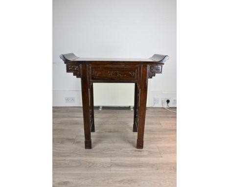 A CHINESE HARDWOOD ALTAR TABLE WITH DRAWER AND TRAY, 20TH CENTURY. Heavy compact rectangular table with traditional upward cu