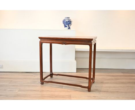 A LATE 19TH/20TH CENTURY CHINESE CARVED ELM ALTAR TABLE. Of rectangular section, with scroll carved frieze, on moulded square