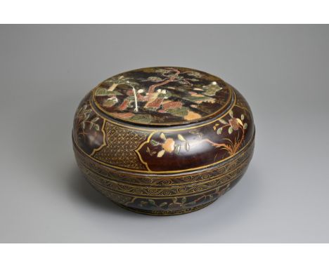 A 19TH CENTURY CHINESE LACQUERED AND INLAID DOMED CIRCULAR BOX AND COVER. The cover decorated with women before rockwork, bam