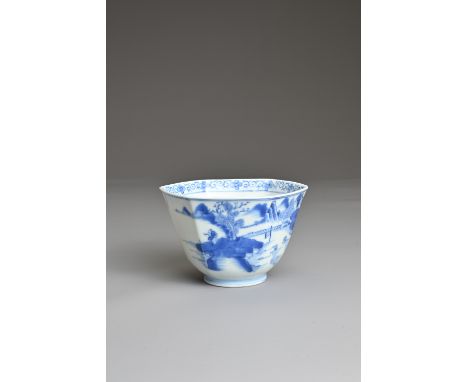 A CHINESE BLUE AND WHITE PORCELAIN CUP, JIAQING 19TH CENTURY. Of hexagonal form decorated with figure and boat in a coastal l