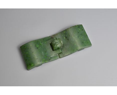 A CHINESE SPINACH JADE BELT BUCKLE, QING DYNASTY. Of two interlocking sections with dragon head hook. 11.5cm length. Total we