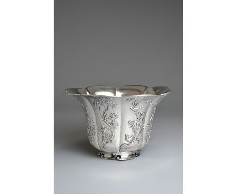 A CHINESE EXPORT SILVER OCTAGONAL LOBED BOWL, LUEN WO, SHANGHAI, 19/20TH CENTURY. Each panel decorated in relief with various