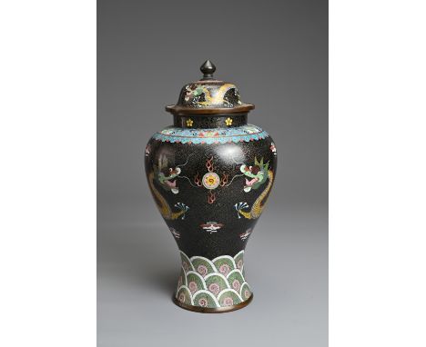 A CHINESE CLOISONNE ENAMEL VASE AND COVER, EARLY 20TH CENTURY. Black ground with dragons chasing flaming pearl above a band o