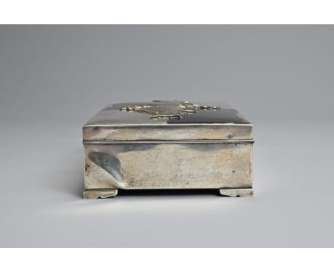 A 20TH CENTURY JAPANESE WHITE METAL AND ENAMEL MOUNTED WOODEN RECTANGULAR BOX. The top applied with opposing fish amongst scr