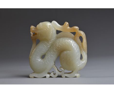 A CHINESE PALE CELADON JADE CARVING OF A DRAGON. 5cm tall. Weight 70 grams. Good overall condition.