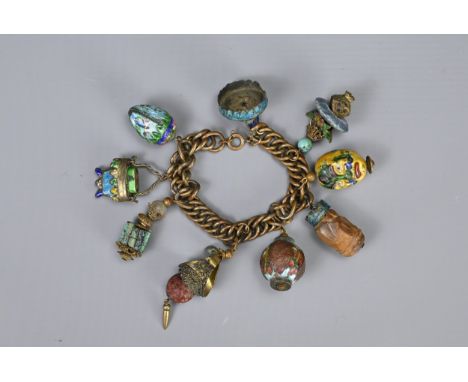 A VINTAGE CHINESE CLOISONNE ENAMEL CHARM BRACELET. A metal linked chain with nice charms to include carved wood, cinnabar lac