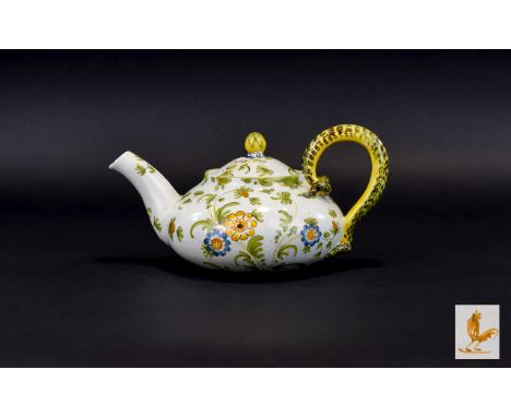 Cantagalli Faience Teapot late 19th century Of squat ovoid form, the sides with a twin naturalistic scroll handle, painted wi