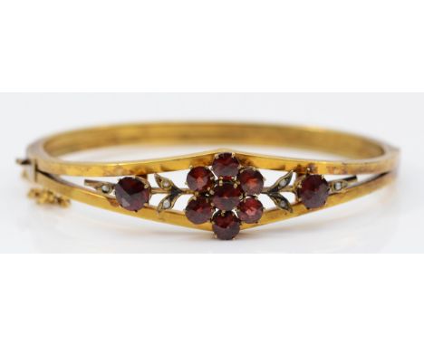A late 19th century gilt metal and Bohemian garnet cluster bangle, 57 x 47mm. 