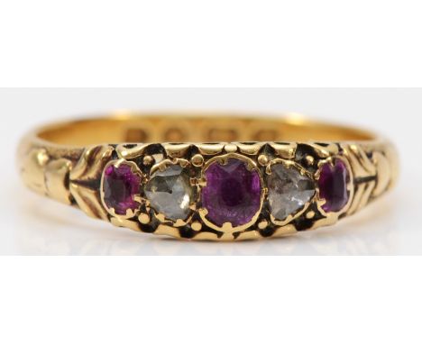 A Victorian 18ct gold, rose diamond and ruby five stone ring, Birmingham 1886, carved shoulders, P 1/2, 2.7gm 