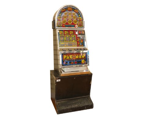 Pac Man, a category C gaming machine, recently retired from service, 67 × 60 × 185 cm.Lights up but has no keys so we cannot 