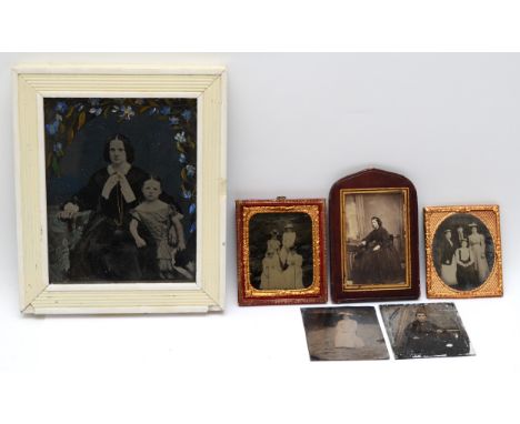 A collection of Victorian photographs, to include a daguerreotype portrait of a lady and child, three framed ambrotypes and t