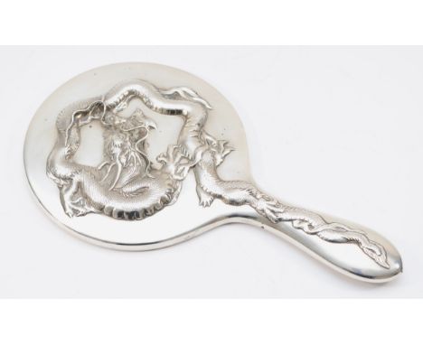A Chinese silver hand mirror, by Wing Nam &amp; Co, Hong Kong, c.1900/10, with applied four claw dragon, bevelled glass, 28cm