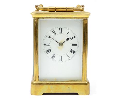 An early 20th century brass case carriage clock, having enamelled dial with Roman numerals, the 8 day movement striking on go