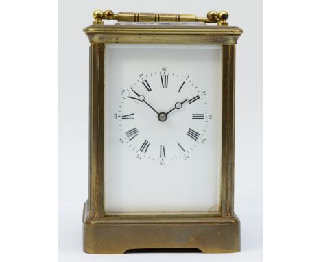 An early 20th century brass case carriage clock, the enamelled dial with Roman and Arabic numerals, housing an 8 day barrel m