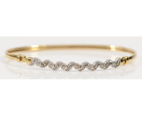 A 9ct gold and diamond set sprung bangle, 65 x 51mm, 4.9gm 