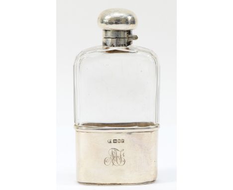 A silver and glass hip flask, by Mappin &amp; Webb, London 1910, with bayonet cap and pull off base, initialled, 13cm. 