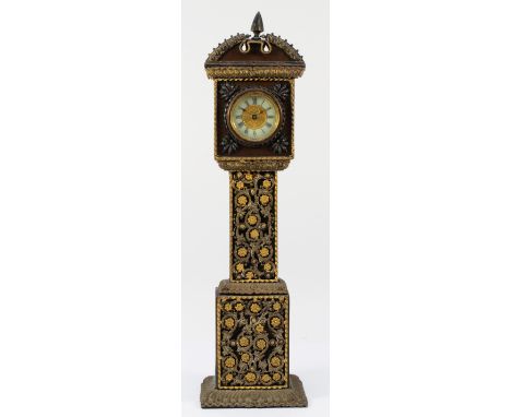 An early 20th century miniature longcase clock, the silk covered mahogany case with gilt ormolu mounted decoration, housing a