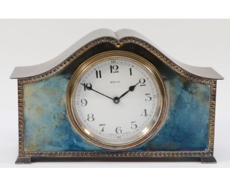 An early 20th century electroplate mantel clock, with gadrooned border, the white enamel dial with Arabic numerals, French 8 