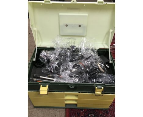 A Shakespeare tackle box including fishing reels Abu Garcia 506MK II, Intrepid Black prince, Daiwa Ninja Match 2508a and a co