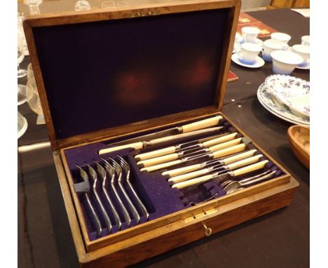 Oak cased canteen of cutlery dated 1915 missing carving fork and salt spoon 