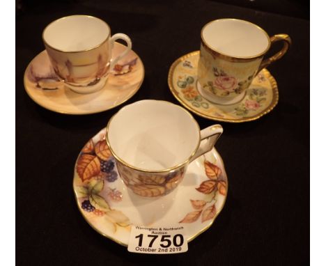 Set of three Royal Worcester cabinet cups and saucers Bramble London and English Flower patterns