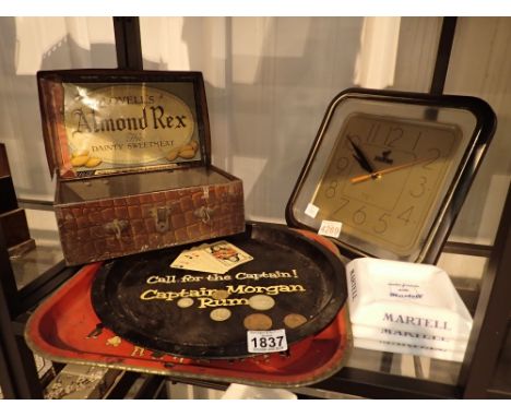 Collection of pub related items including Martell ashtray Bells clock pub taps and vintage tray