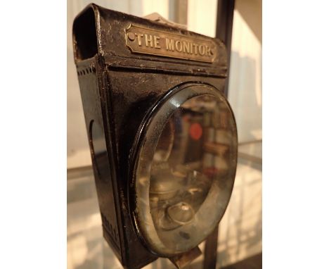 Spirit fired lamp The Monitor with nameplate to front. Possibly car / motorcycle / bicycle / ship use and oval bevel edged gl
