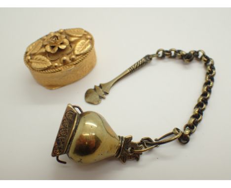 Small yellow metal pill box marked Italy and a unusal snuff box and spoon with chain 