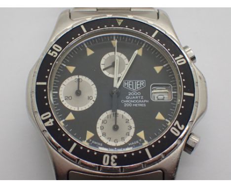 Heuer quartz stainless steel wristwatch with triple subsidiary dials date aperture and rotating bezel in stainless steel case