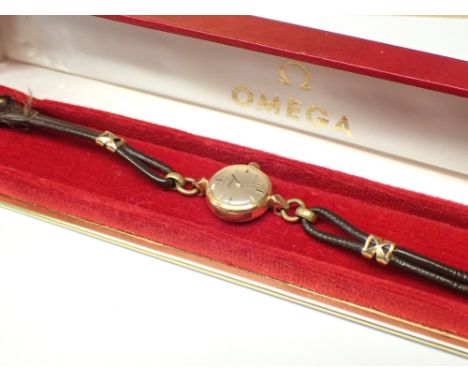 OMEGA vintage ladies boxed wristwatch having baton chapters against a silvered dial on leather strap CONDITION REPORT: This i